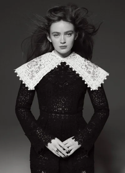 Portrait of Sadie Sink wearing a black lace dress with an ornate white collar, photographed by Philip Gay for Elle Australia.