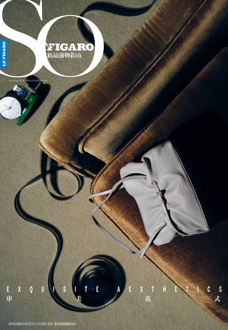 SO Figaro magazine cover featuring a tan upholstered chair, a gray handbag, and a vintage wristwatch on a neutral background.