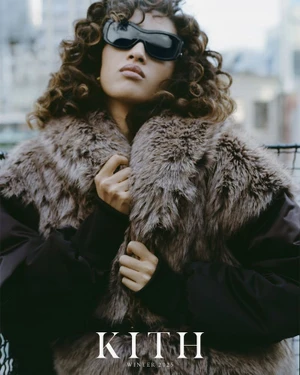 Model Aqua Parios wearing black wraparound sunglasses and a textured brown faux fur jacket for Kith Women Winter 2025.
