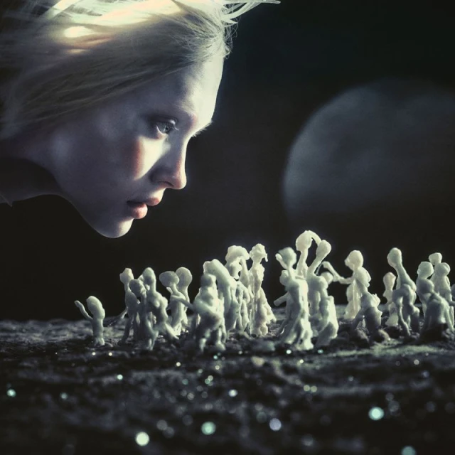 Dramatic image of a woman gazing at a miniature crowd, lit by a mysterious moon. Surreal atmosphere, contrasted by a stark, dark background.