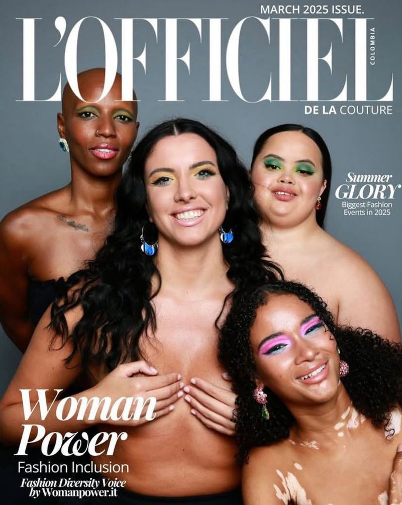 Magazine cover featuring four diverse women with striking makeup, promoting fashion inclusion and women's empowerment against a grey backdrop.