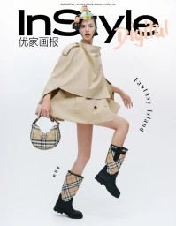 Model Qun Ye wearing a beige cape jacket, plaid boots, and holding a matching handbag on a white background for InStyle China.