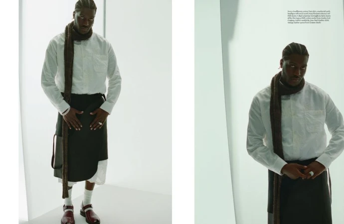 Lil Yachty in a white shirt and apron scarf posing against a white studio background for Arena Homme +