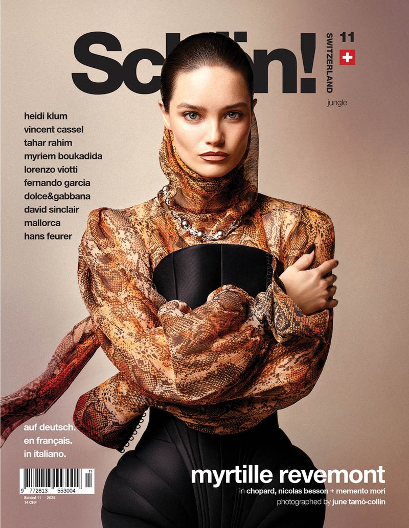 Schön! Magazine cover featuring a model wearing a snakeskin-patterned blouse with a black corset and a statement necklace.