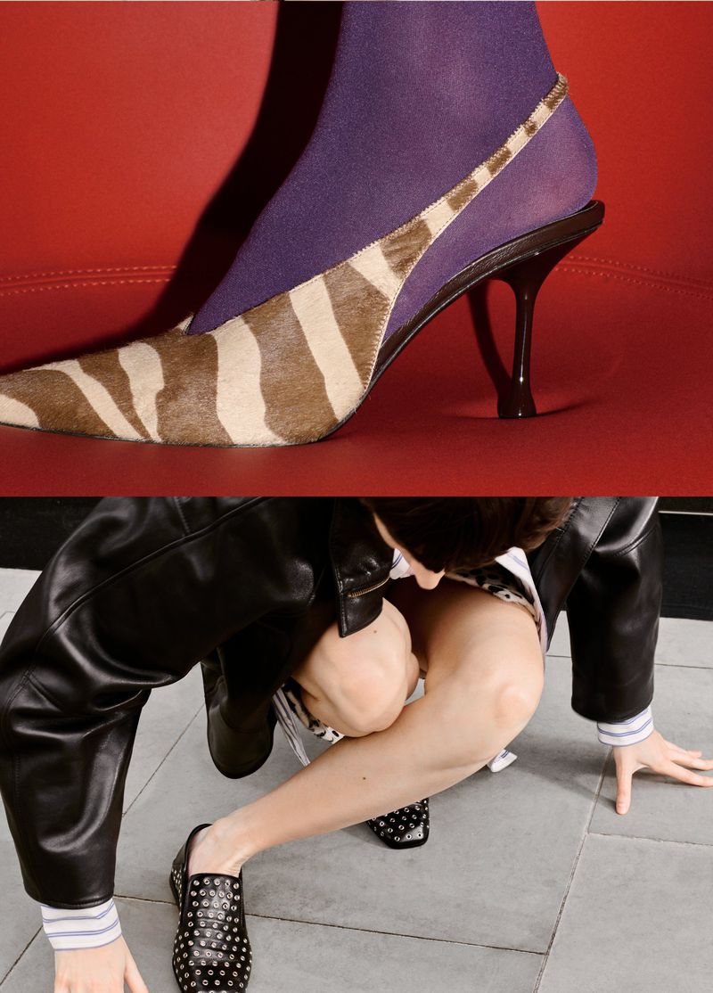 Closeup of animal print heel on red surface, second model in studded flats and leather jacket on grey floor. Fashion editorial.