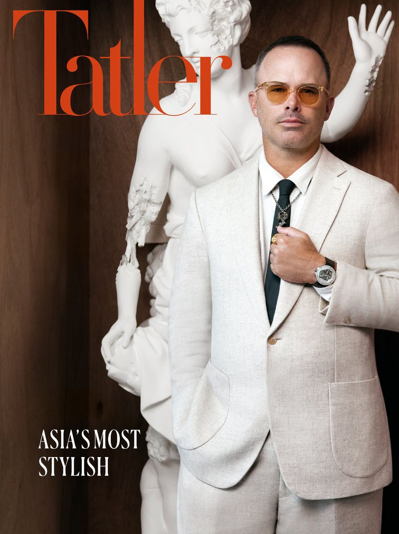 Magazine cover featuring a portrait of a stylish adult man in a white suit with a statue in the background and the Tatler logo.