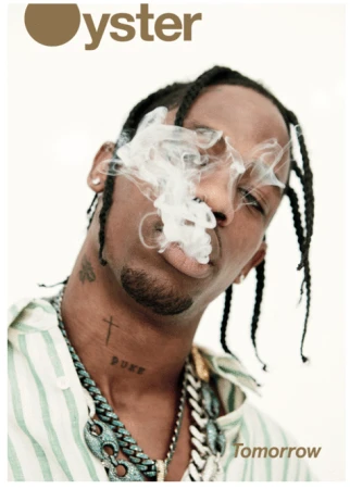 Magazine cover featuring an adult male model with braided hair, wearing a striped shirt and jewelry, with smoke near his mouth.
