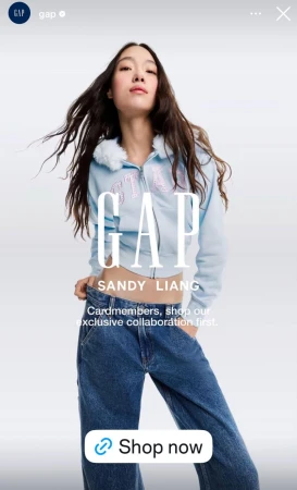 Model Zhong Mei wearing a light blue zip-up hoodie and jeans against a white background for Gap X Sandy Liang
