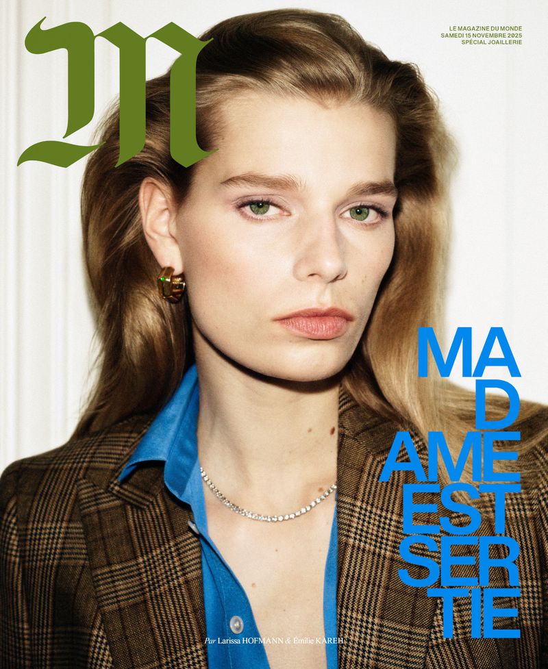 Magazine cover featuring a blonde adult female model wearing a blazer and necklace, with the magazine's title in green, modern font.