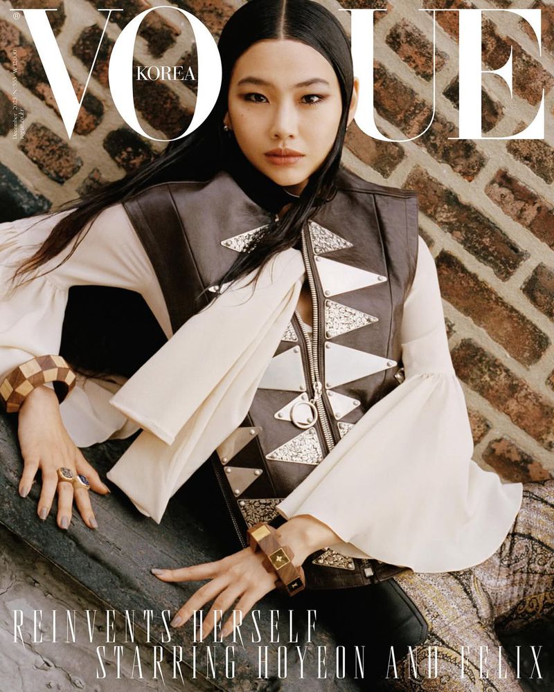 Vogue Korea cover featuring Hoyeon Jung wearing a brown leather vest and cream blouse, against a brick wall and the masthead.
