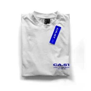 Neatly folded white crewneck t-shirt featuring blue CA.ST branding and a matching blue hangtag on a white background.