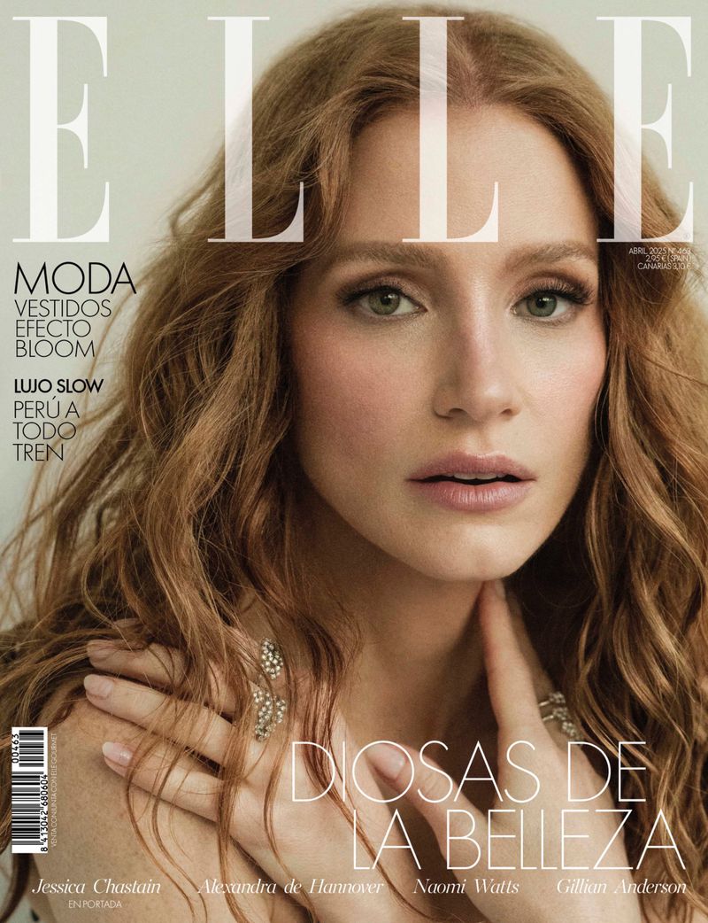 Close-up magazine cover featuring Jessica Chastain, an adult female with long red hair, wearing a ring, and soft makeup on a neutral background.