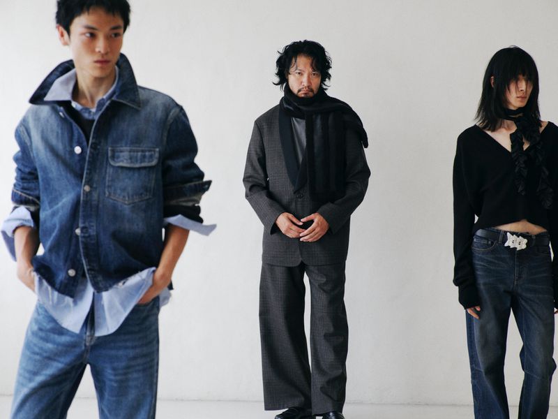 Three models wearing layered contemporary clothing standing against a plain white background for Our Legacy Fall/Winter 25 campaign.