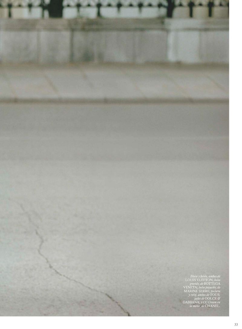 Urban street scene featuring a concrete surface with a weathered texture, subtle crack, and architectural details in the background.