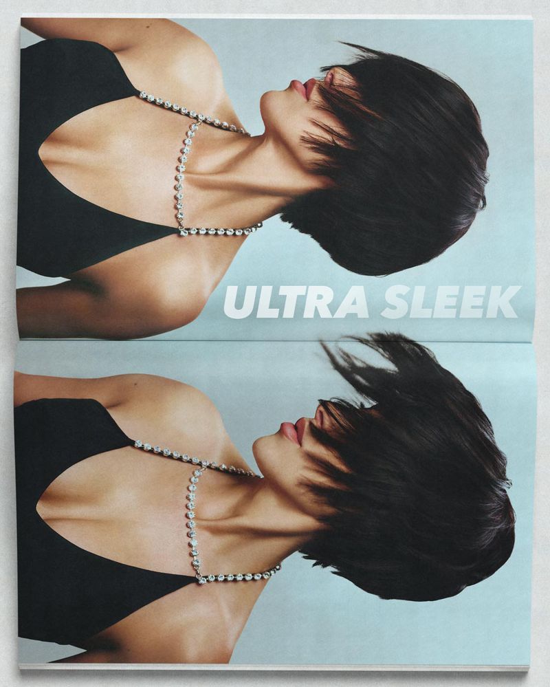 Magazine image featuring a woman with dark hair and a necklace, mirrored vertically, against a light blue background with the words 'Ultra Sleek'.
