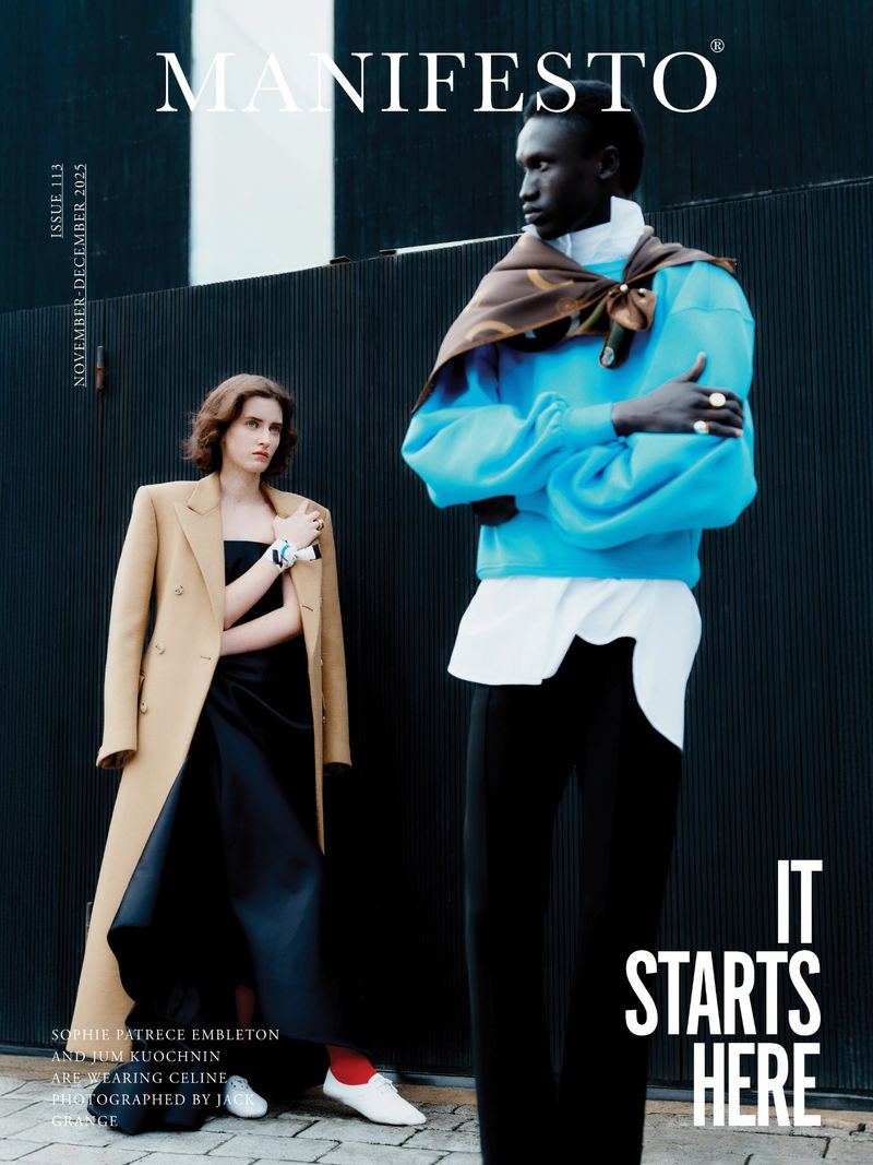 Two models posing against a dark ribbed wall for Manifesto Magazine November December 2025 cover.