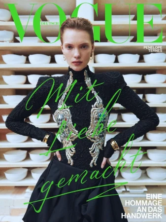 Vogue Deutsch magazine cover featuring Penelope Ternes in a black dress against a backdrop of pottery bowls on shelves.
