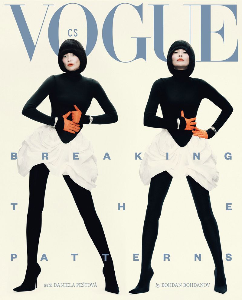 Two women in black turtlenecks, white ruffled skirts, and black tights pose for a fashion magazine cover with a light background and bold text.