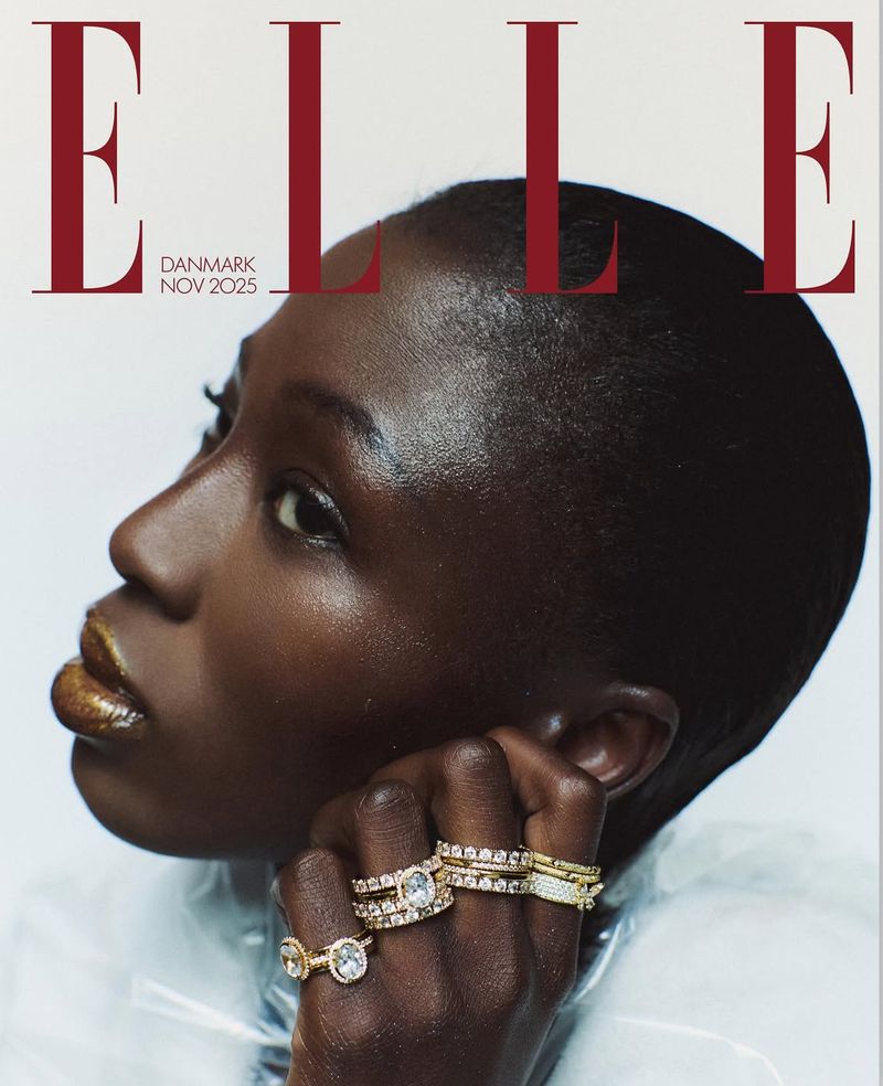 Elle Denmark magazine cover featuring a black woman with gold lips and multiple rings, set against a white background. November 2025.