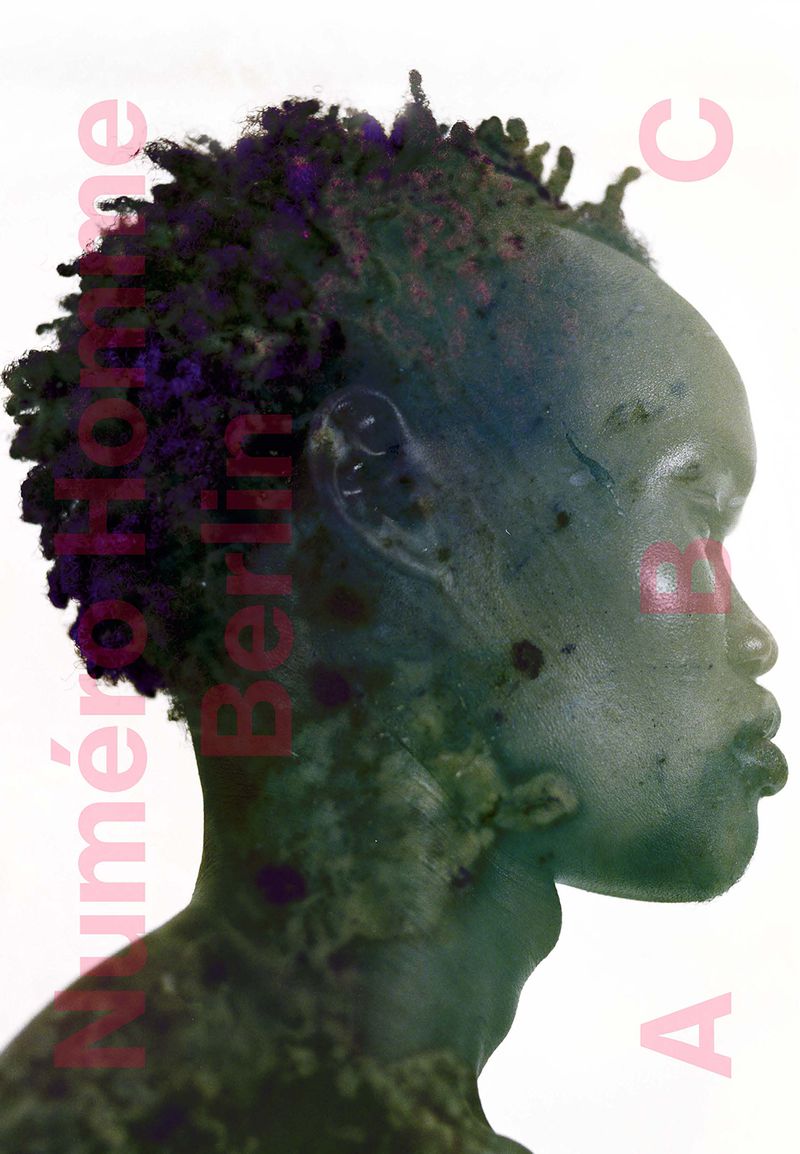 Close-up of African male in side profile; artistic double-exposure effect with plant overlay; pink text on white background.