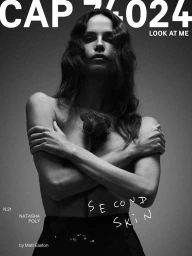 Natasha Poly holding a dark rose against her chest in a monochrome fashion cover portrait by Matt Easton for CAP 74024.