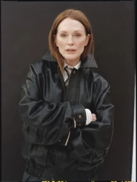 Julianne Moore wearing a black leather jacket against a dark background for Neptune Papers Issue 8