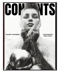 Monochrome magazine cover portrait of Valery Kaufman holding a shiny metallic sphere wearing textured gloves