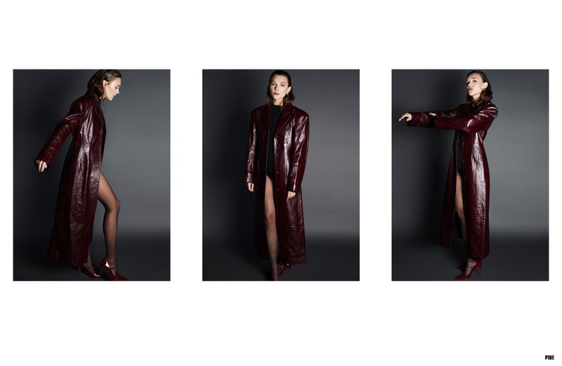 Three shots of a woman wearing a long, red, shiny coat and black tights posing in a photo studio with a gray background.