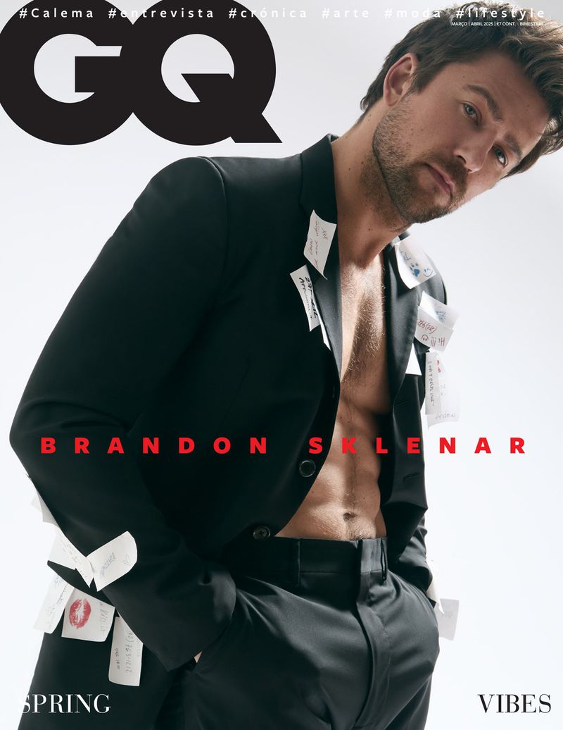 Magazine cover featuring Brandon Selenar in black suit with notes, showcasing his abs. "Spring Vibes" text on a light gradient backdrop.