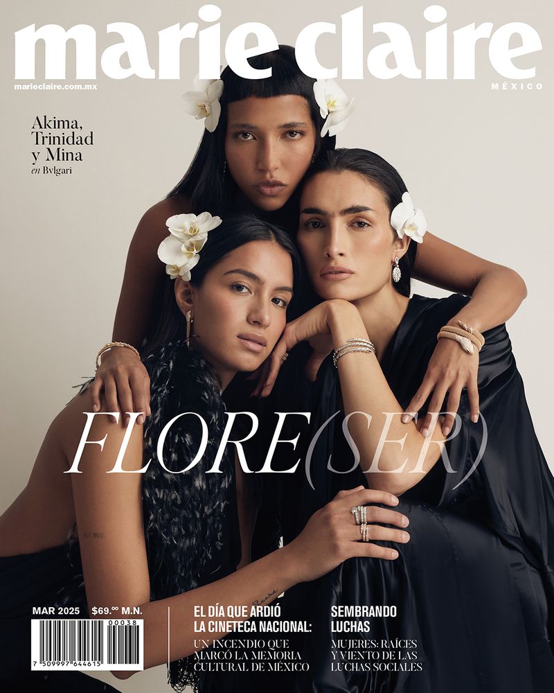 Marie Claire Mexico cover featuring three female models with flowers in their hair, wearing black dresses, and jewelry. Magazine cover.