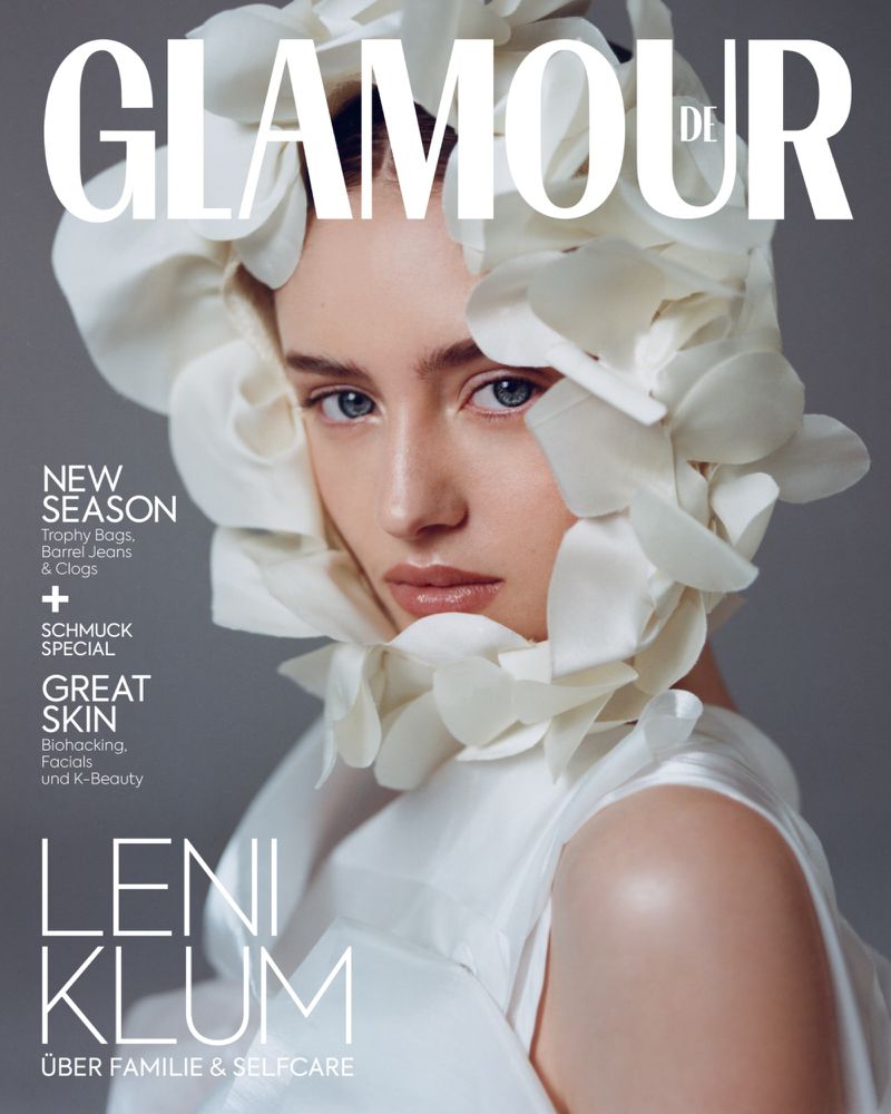 Glamour DE magazine cover featuring a portrait of Leni Klum in a white floral headpiece and matching dress against a gray background.