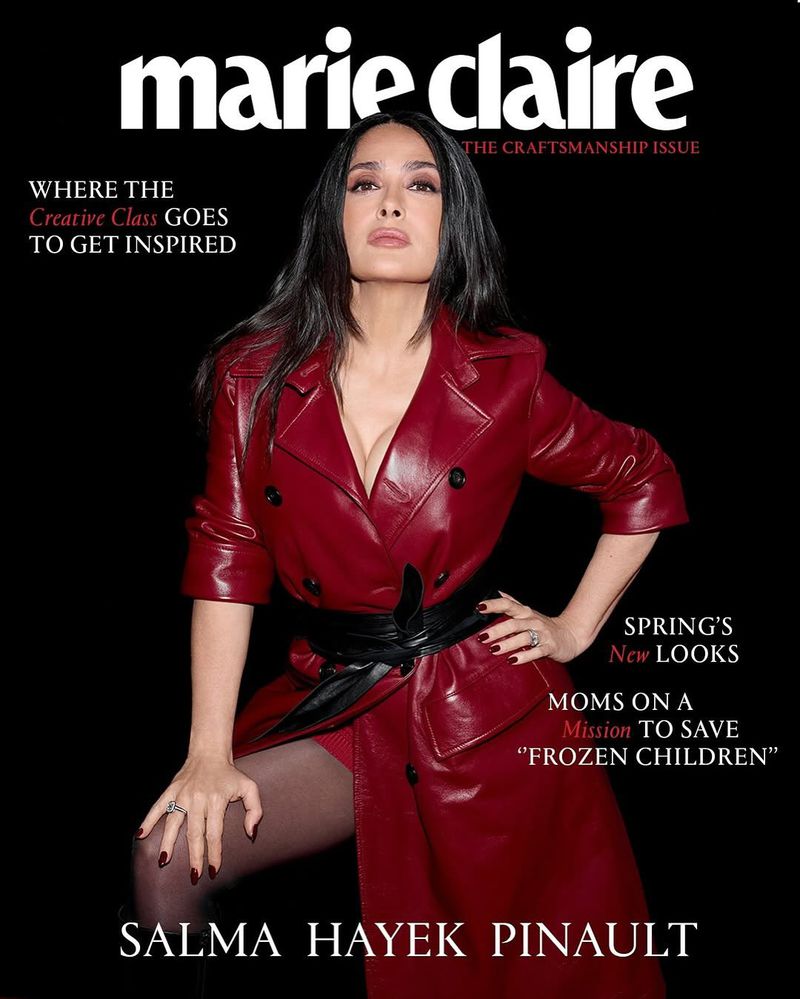 Salma Hayek on the cover of Marie Claire's Craftsmanship Issue. She's wearing a red leather trench coat, black tights, and black heels.