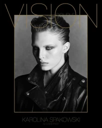 Model with slicked-back dark hair wearing a black leather jacket against a neutral backdrop
