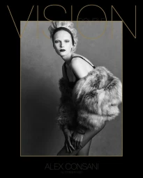 Monochrome fashion portrait of a model in a fur jacket and headband against a neutral grey studio background for Double Vision.
