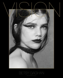 Close-up black and white portrait of a model with dark winged eyeliner and lipstick, featuring bold typographic overlays for Double Vision