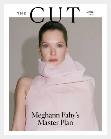 Magazine cover featuring a portrait of an adult female with light skin, wearing a pink dress, with 'The Cut' and publication date.