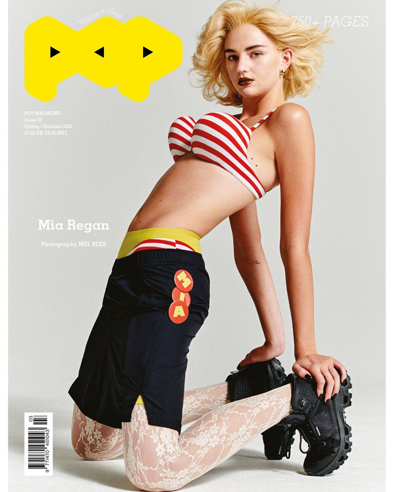 Pop Magazine cover featuring a fair-skinned woman with blonde hair, wearing a striped bikini top, black shorts, and patterned tights.