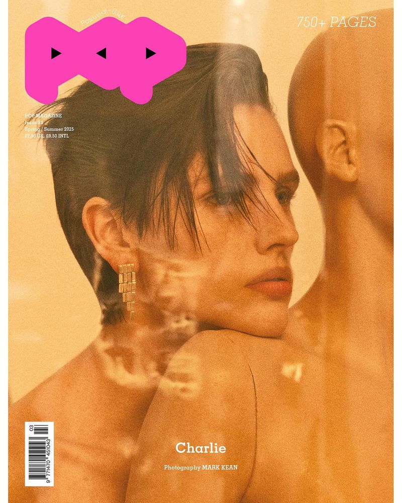 Pop magazine cover featuring a model with an androgynous look wearing earrings and posing with a bare shoulder, and a mannequin.