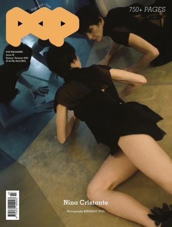 Magazine cover featuring model Nina Cristante in a black dress lying on the floor and a reflection of another model. 