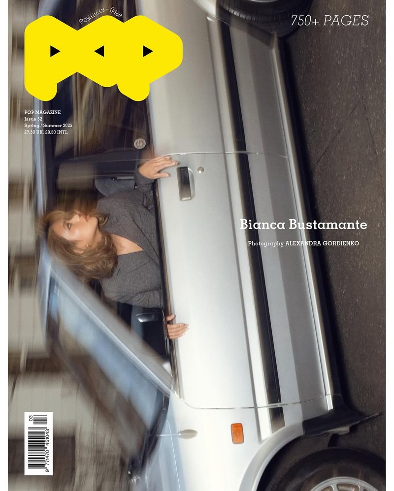 Magazine cover featuring a blonde woman leaning out of a silver car with the magazine title 'POP' in yellow letters.