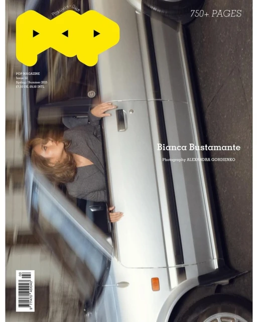 Magazine cover featuring a blonde woman leaning out of a silver car with the magazine title 'POP' in yellow letters.