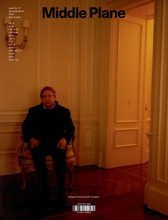 Magazine cover featuring George Condo seated in a formal setting. Warm lighting highlights the architecture and interior design.