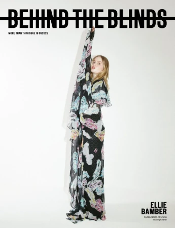 Ellie Bamber wearing a patterned black long dress against a white background for Behind the Blinds #18 Spring/Summer 2025 Cover