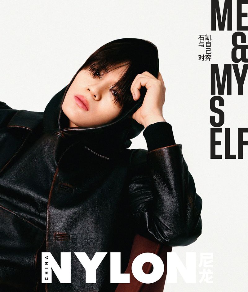Magazine cover featuring a portrait of an adult female with short dark hair in a leather jacket looking at the camera.
