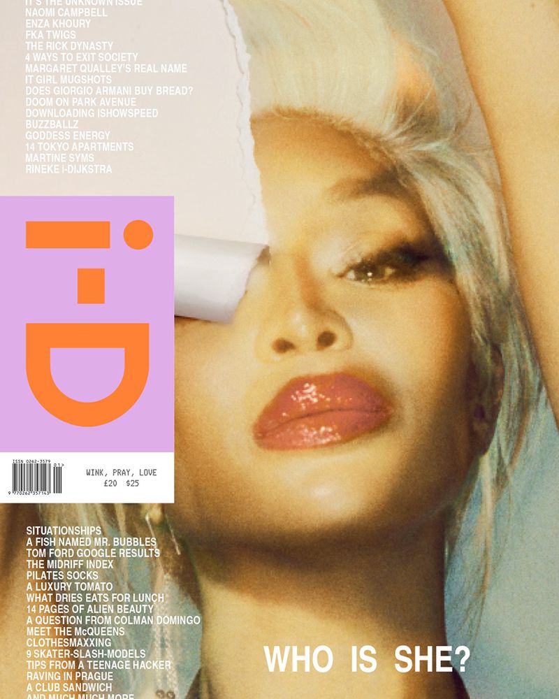 Fashion magazine cover featuring a close-up of a woman's face with glossy lips, framed by a partially torn paper element.