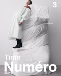 Model Pati Bogusz leaning against a large white fabric wrapped sculpture in an off-white smock dress for Numéro Switzerland.