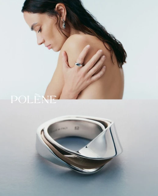 Close-up studio shot of a light-skinned woman wearing a silver ring and earrings, showcasing jewelry with a minimalist aesthetic.