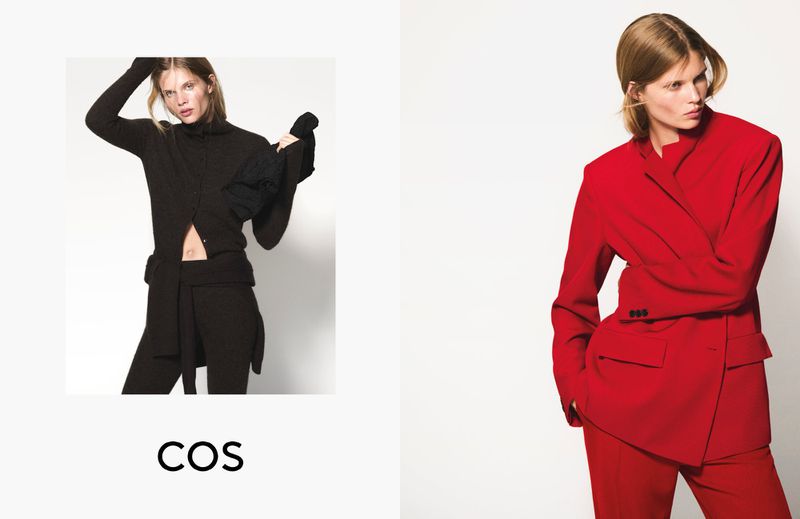 Fashion shot featuring two women in a photo studio. The woman on the left wears black, the woman on the right wears red.