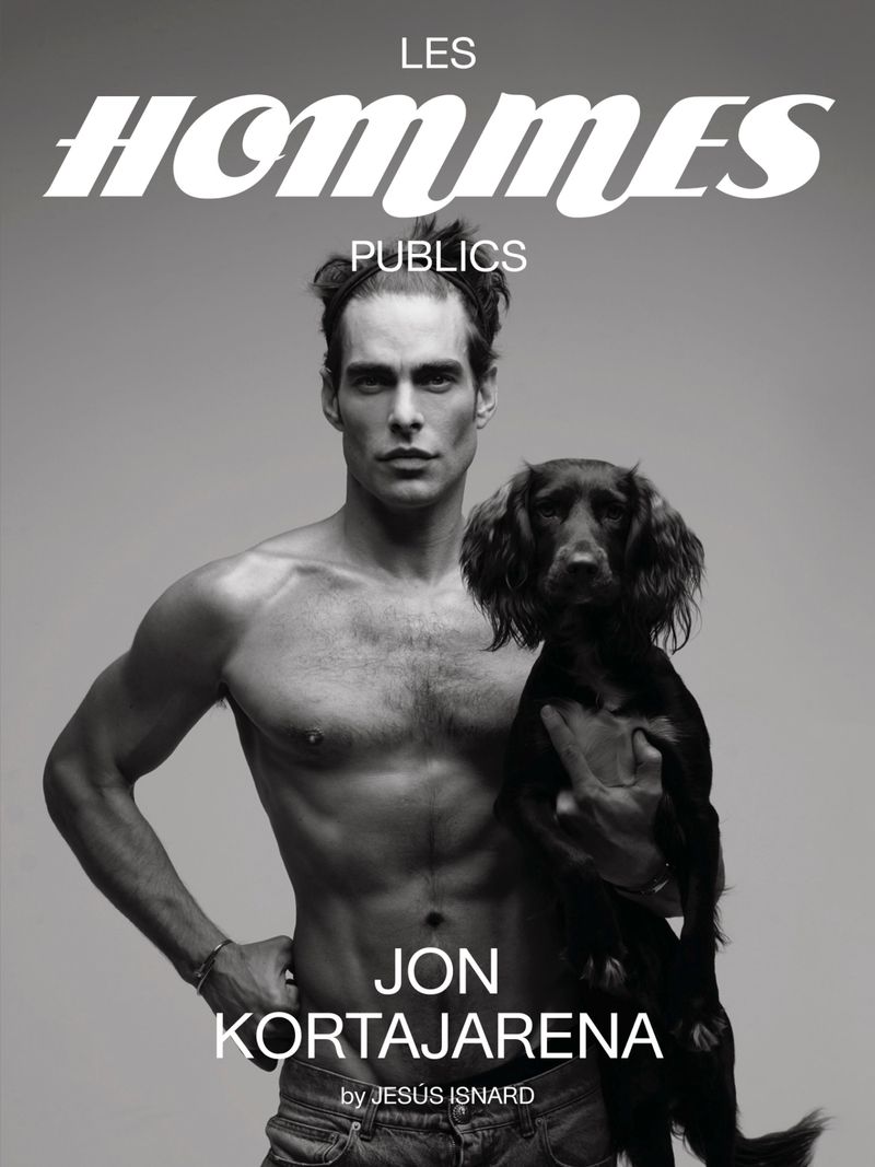 Black-and-white magazine cover featuring a shirtless man and a dark-haired dog, with the magazine title 'Les Hommes Publics' displayed.