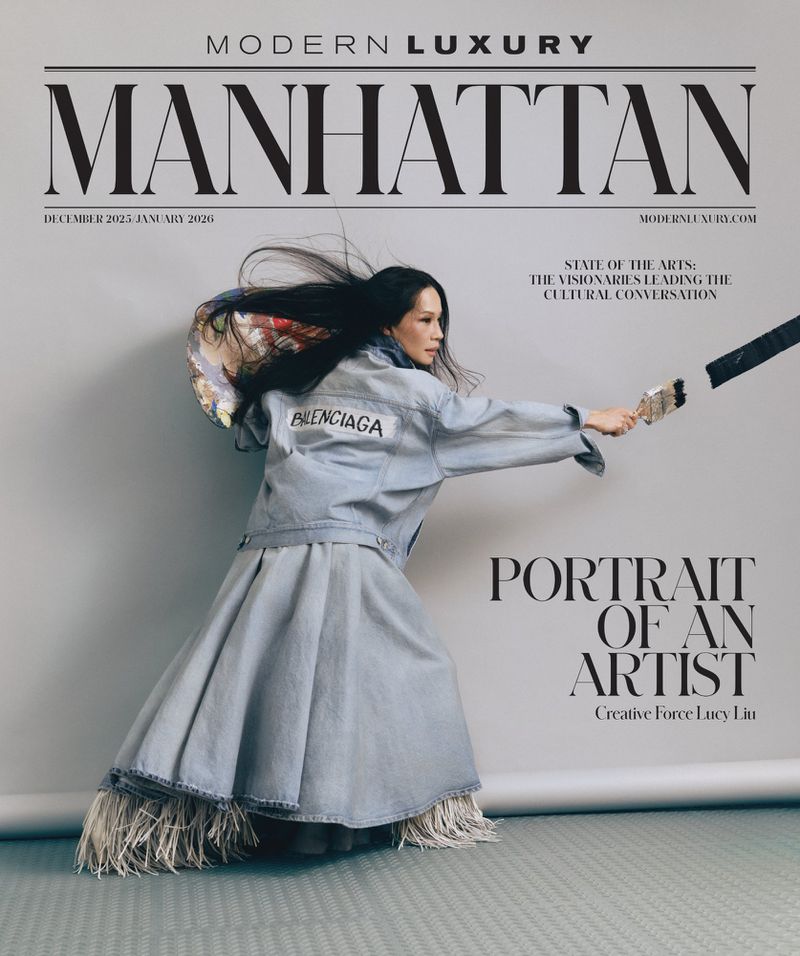 Magazine cover featuring a woman in a denim jacket and skirt holding a paintbrush, with 'Manhattan' and 'Portrait of an Artist' text.